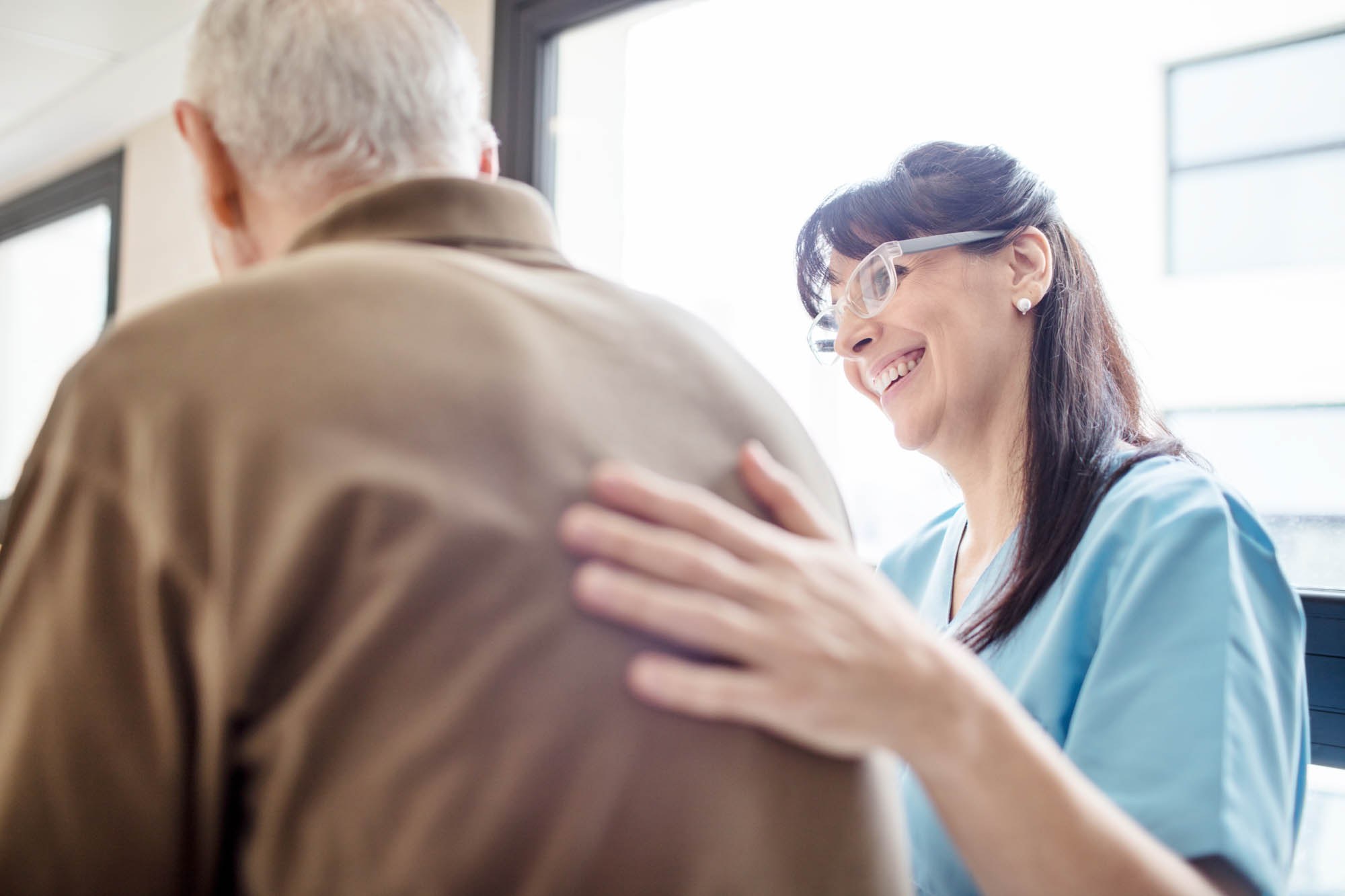 Female health professional and older male