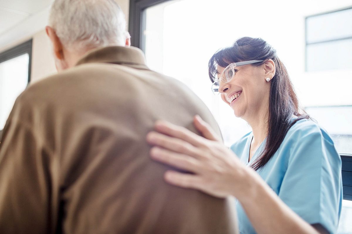 Female health professional and older male